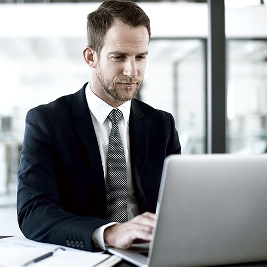man looking at computer