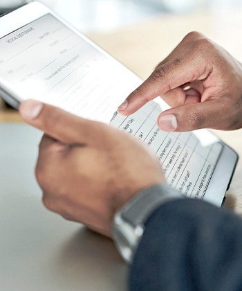 hands with a tablet