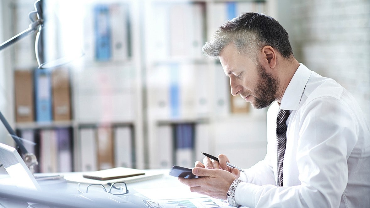 man looking at phone