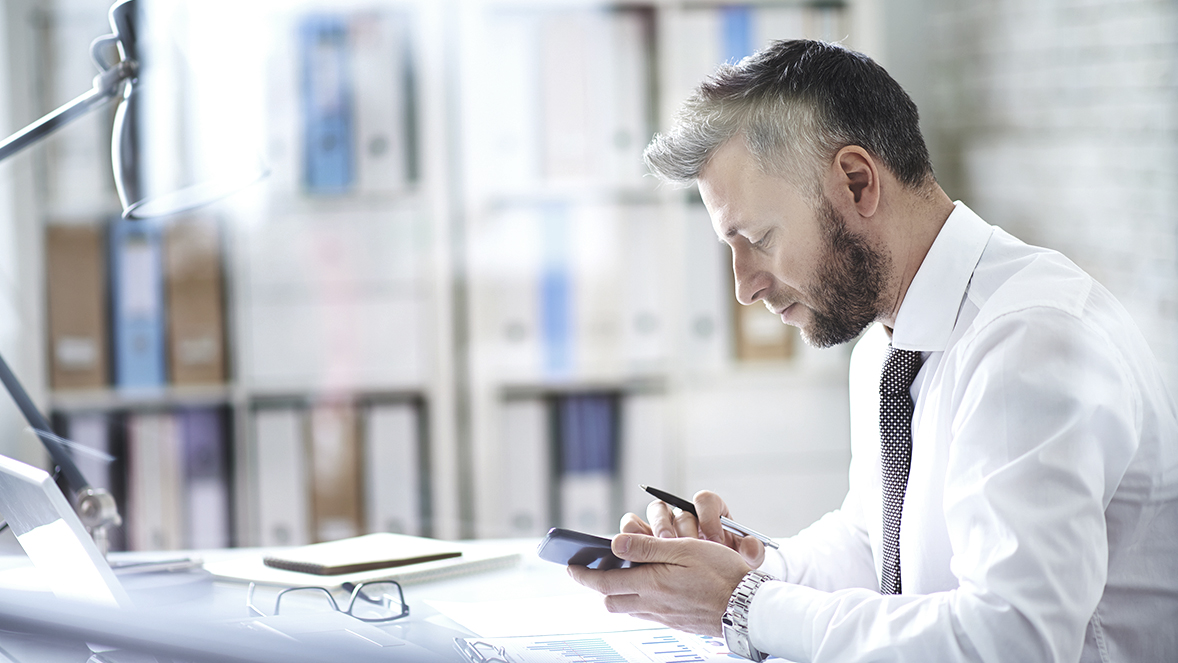 man looking at phone