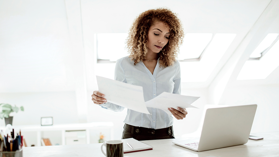 women looking at papers