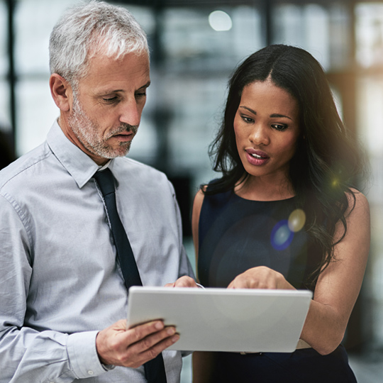 people discussing with a tablet