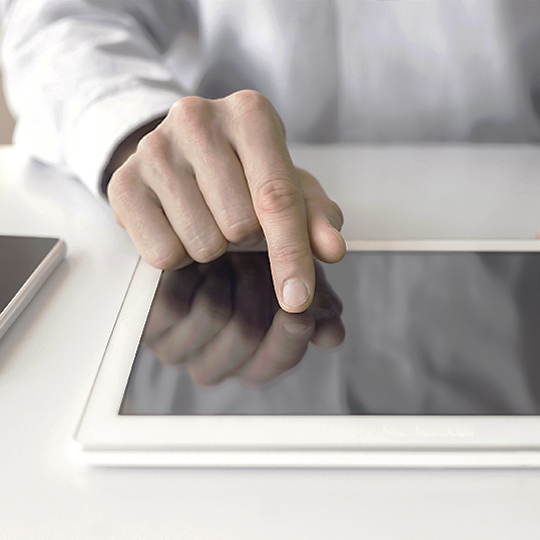 man signing on tablet