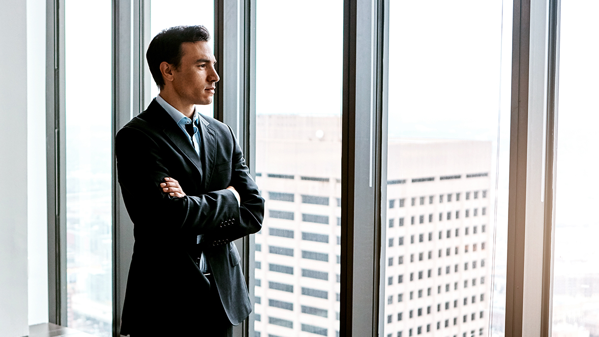 man looking to the window