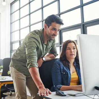 colleagues working in an open plan office