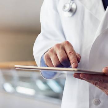 Automation: The Future of Work doctor holding a tablet