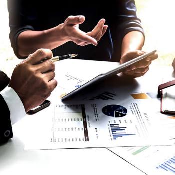 The benefits of automated accounting close up of man pointing at tablet