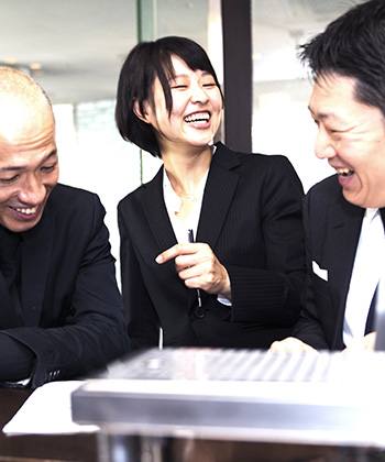 colleagues laughing in a meeting