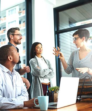 Create scalability for business growth businesswoman explaining something to colleagues in a meeting