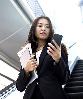 Assure the accuracy of information businesswoman checking her smartphone