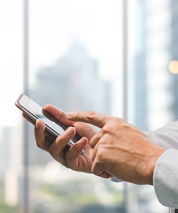 Save resources which matter most: time and money close up of hand texting on a smartphone
