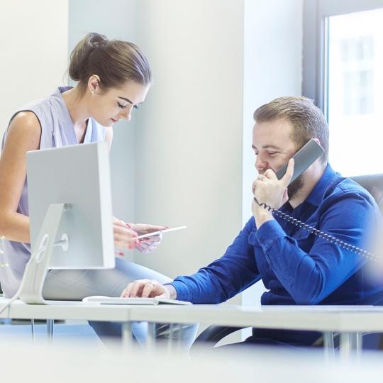 Think it might be time to look at your IT infrastructure? people with phones