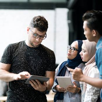 How the cloud is transforming the education people discussing with tablets