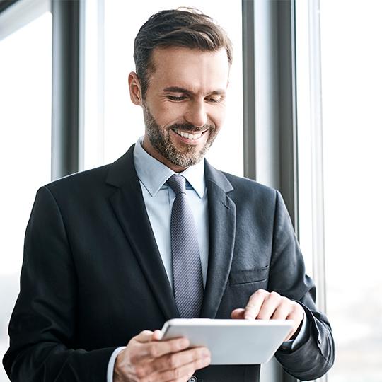 The link between mobility, happiness, and productivity man with a tablet