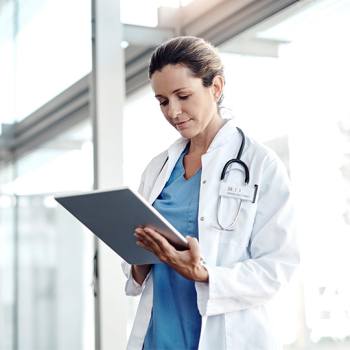 Using technology to improve healthcare doctor with tablet