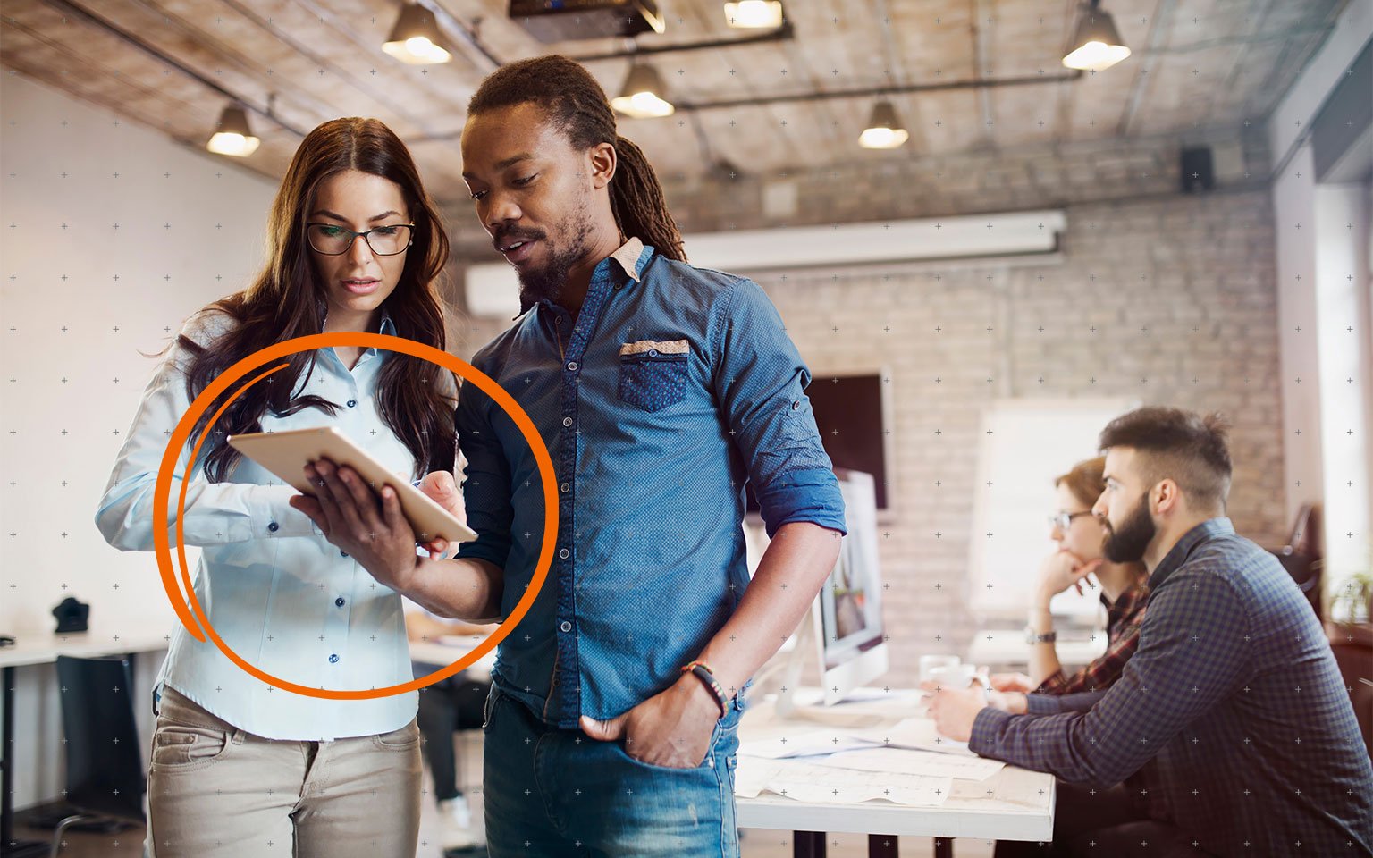 two people looking at tablet